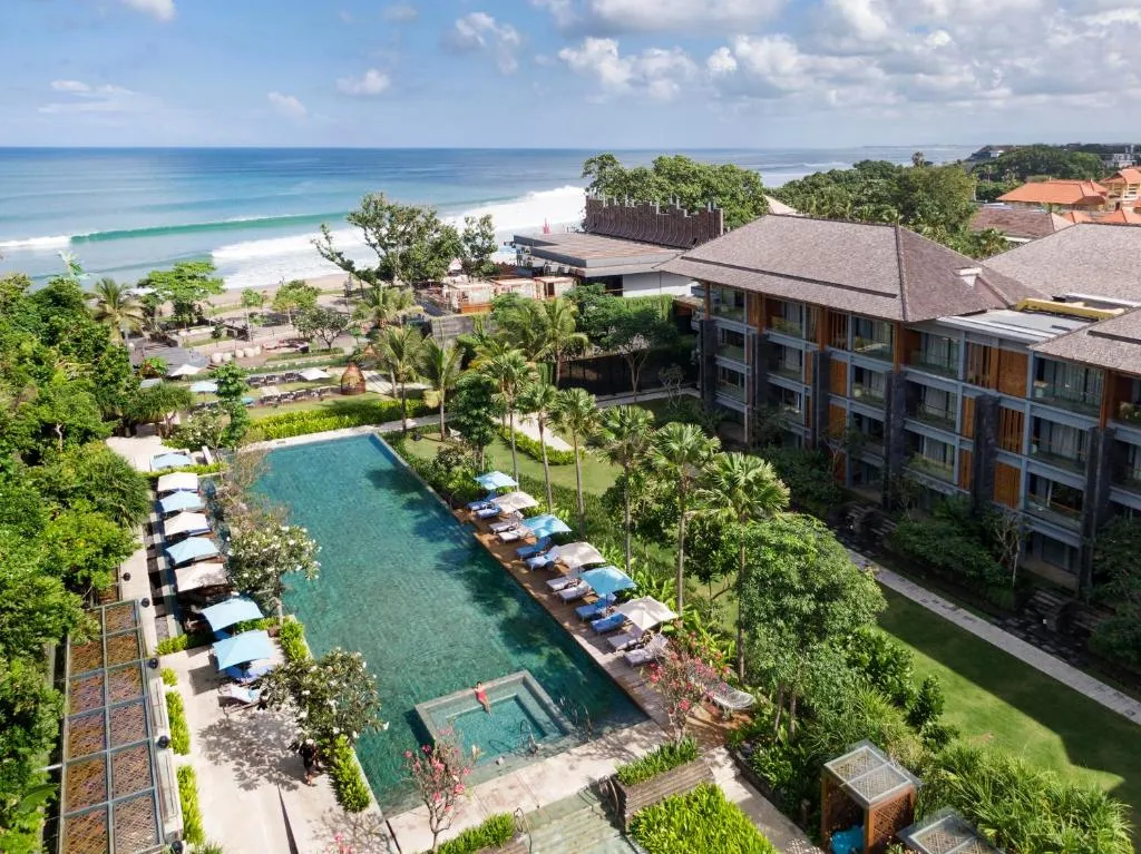 main-pool-and-seminyak-beach-aerial-hotel-indigo-bali